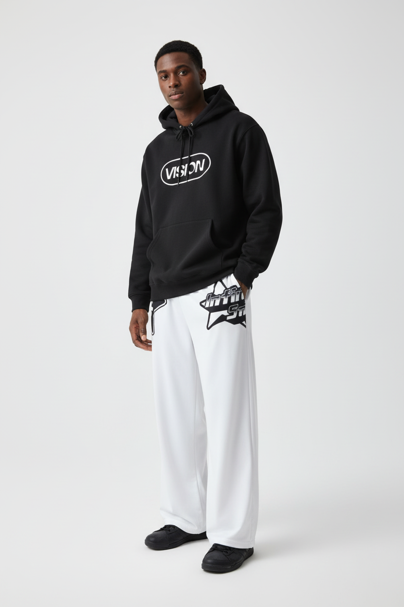 Male model wearing pajama pants and hoodie
